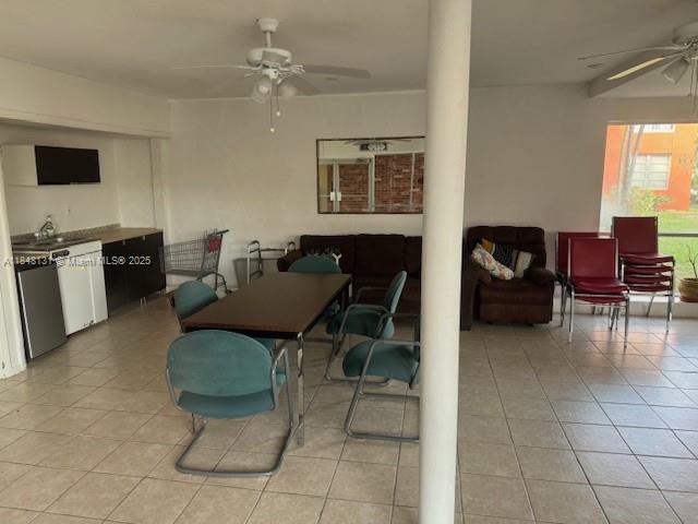1850 Northeast 169th Street, Unit 308 North Miami Beach, FL 33162 - Photo 10 of 29 a living room with furniture and a flat screen tv