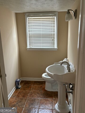 3419 Columbia Court Decatur, GA 30032 - Photo 12 of 17 a bathroom with a sink a toilet and a window