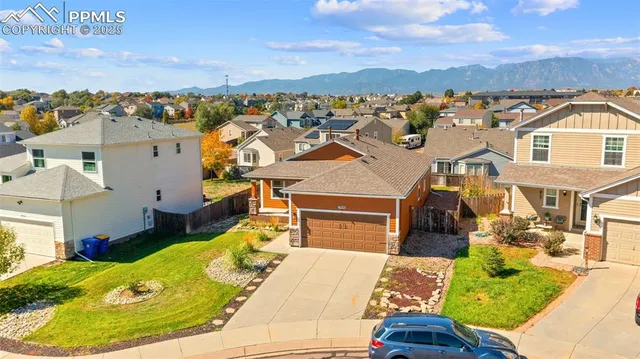 an aerial view of a house with swimming pool