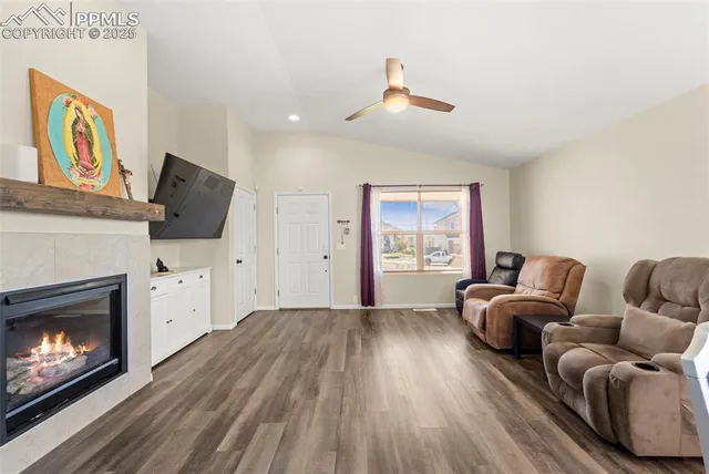 a living room with furniture and a fireplace