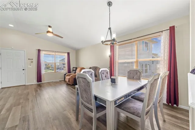 a view of a dining room with furniture window and wooden floor
