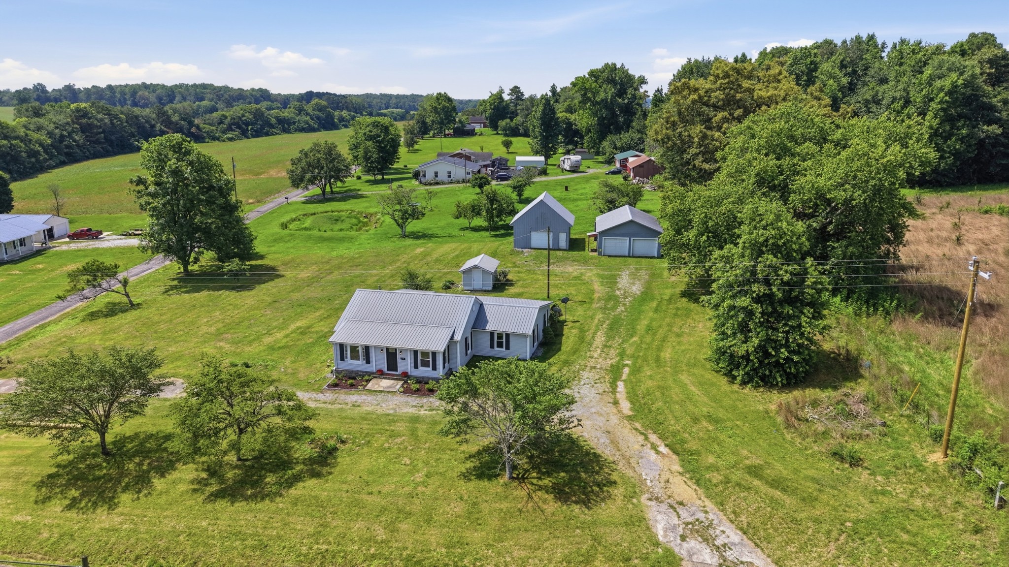 469 Fred Cooper Road McMinnville, TN 37110 - Photo 43 of 46 an aerial view of a house with a garden