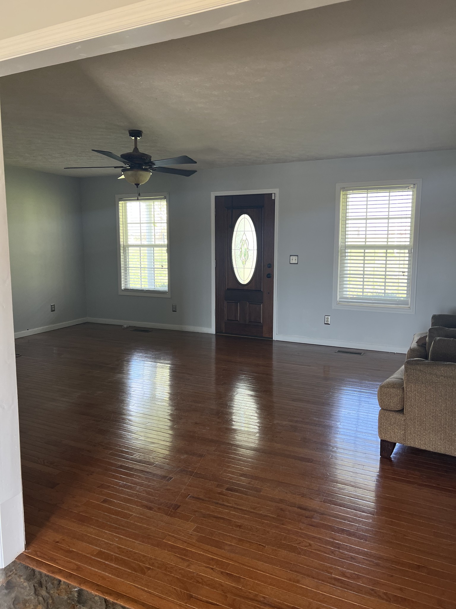806 Denning Ford Road Portland, TN 37148 - Photo 11 of 31 an empty room with wooden floor and windows