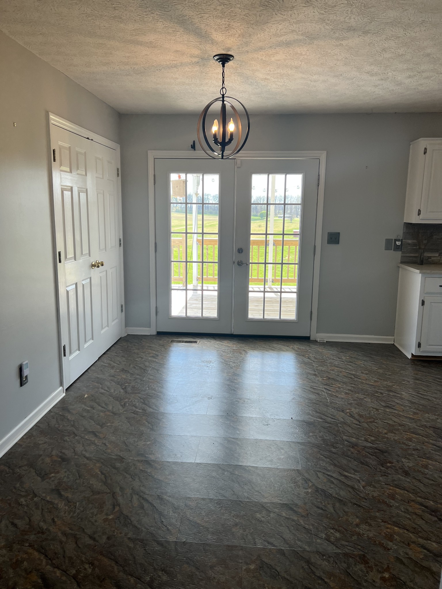 806 Denning Ford Road Portland, TN 37148 - Photo 8 of 31 an empty room with wooden floor and windows