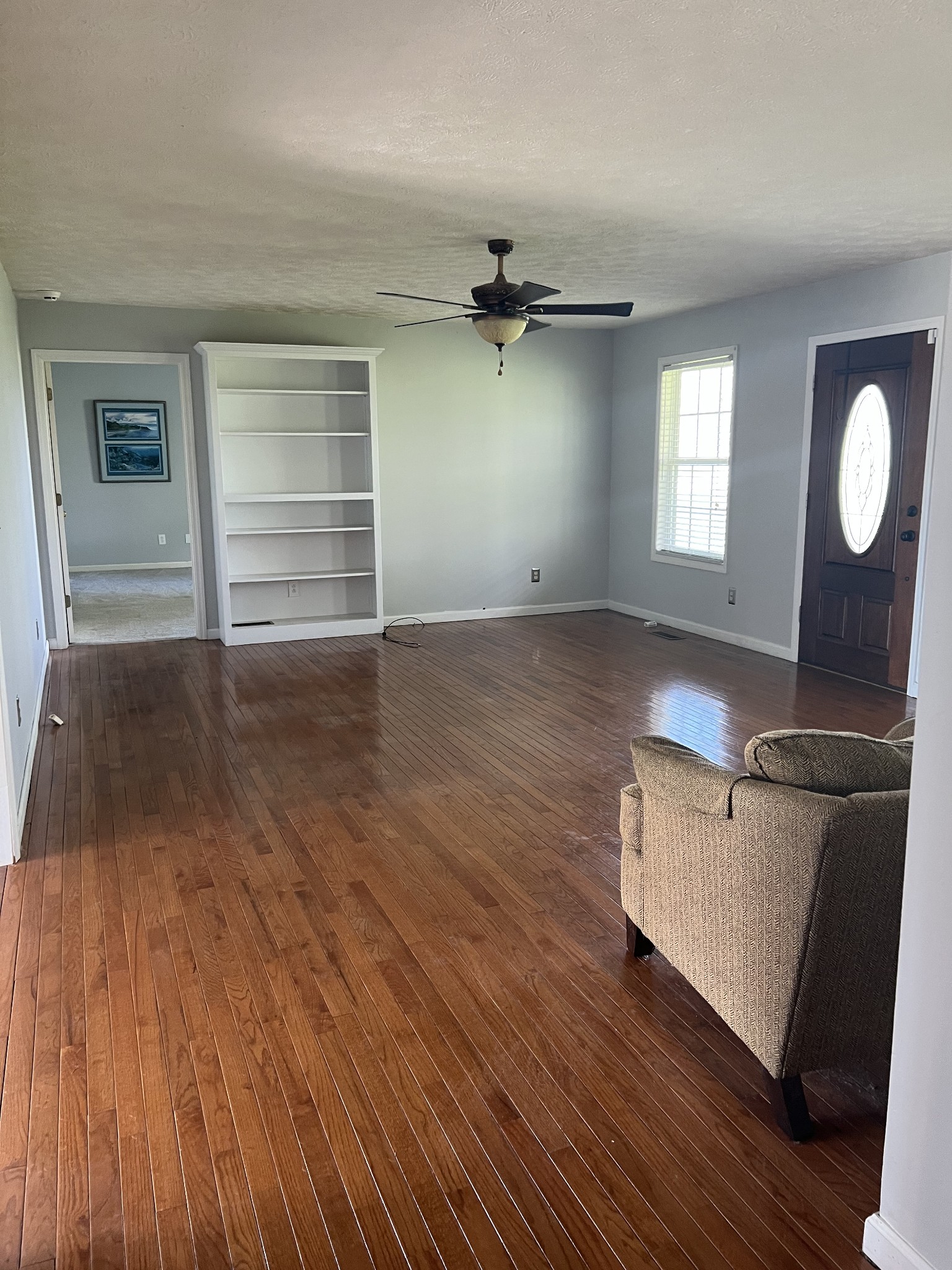 806 Denning Ford Road Portland, TN 37148 - Photo 10 of 31 an empty room with wooden floor cabinet and windows