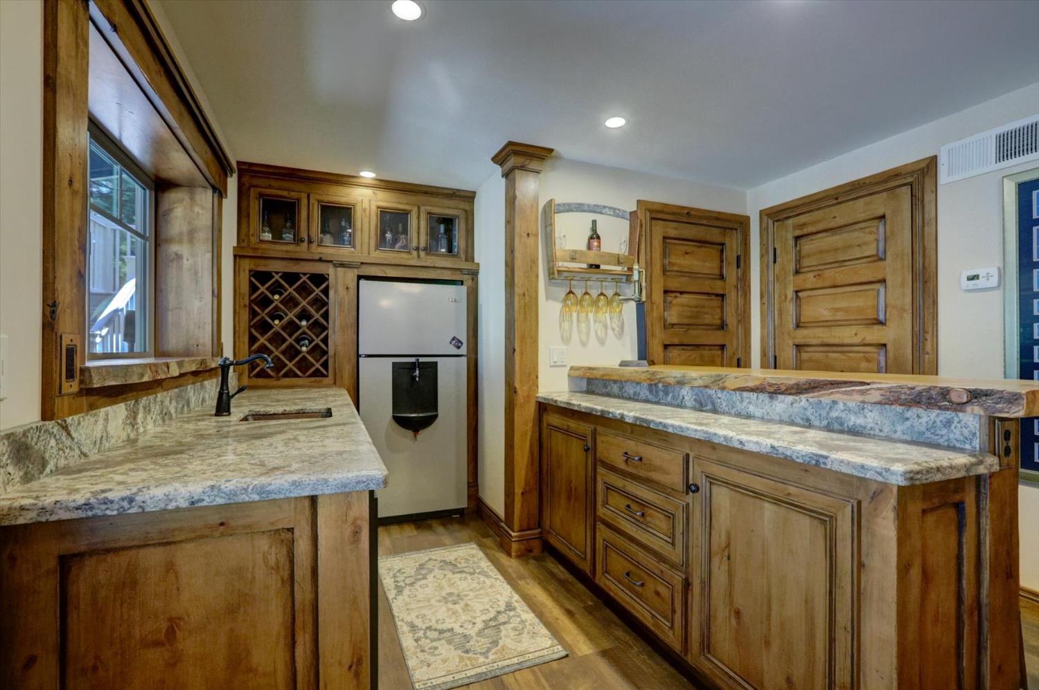 19793 Scotts Flat Road Nevada City, CA 95959 - Photo 18 of 50 a kitchen with stainless steel appliances granite countertop a stove and a sink
