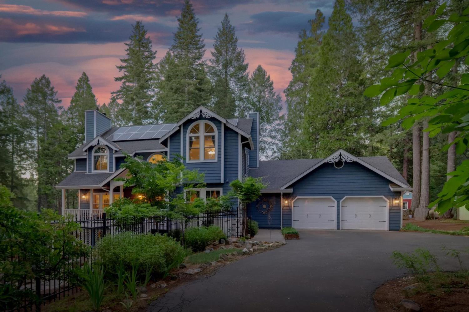 19793 Scotts Flat Road Nevada City, CA 95959 - Photo 2 of 50 a front view of a house with a yard and garage