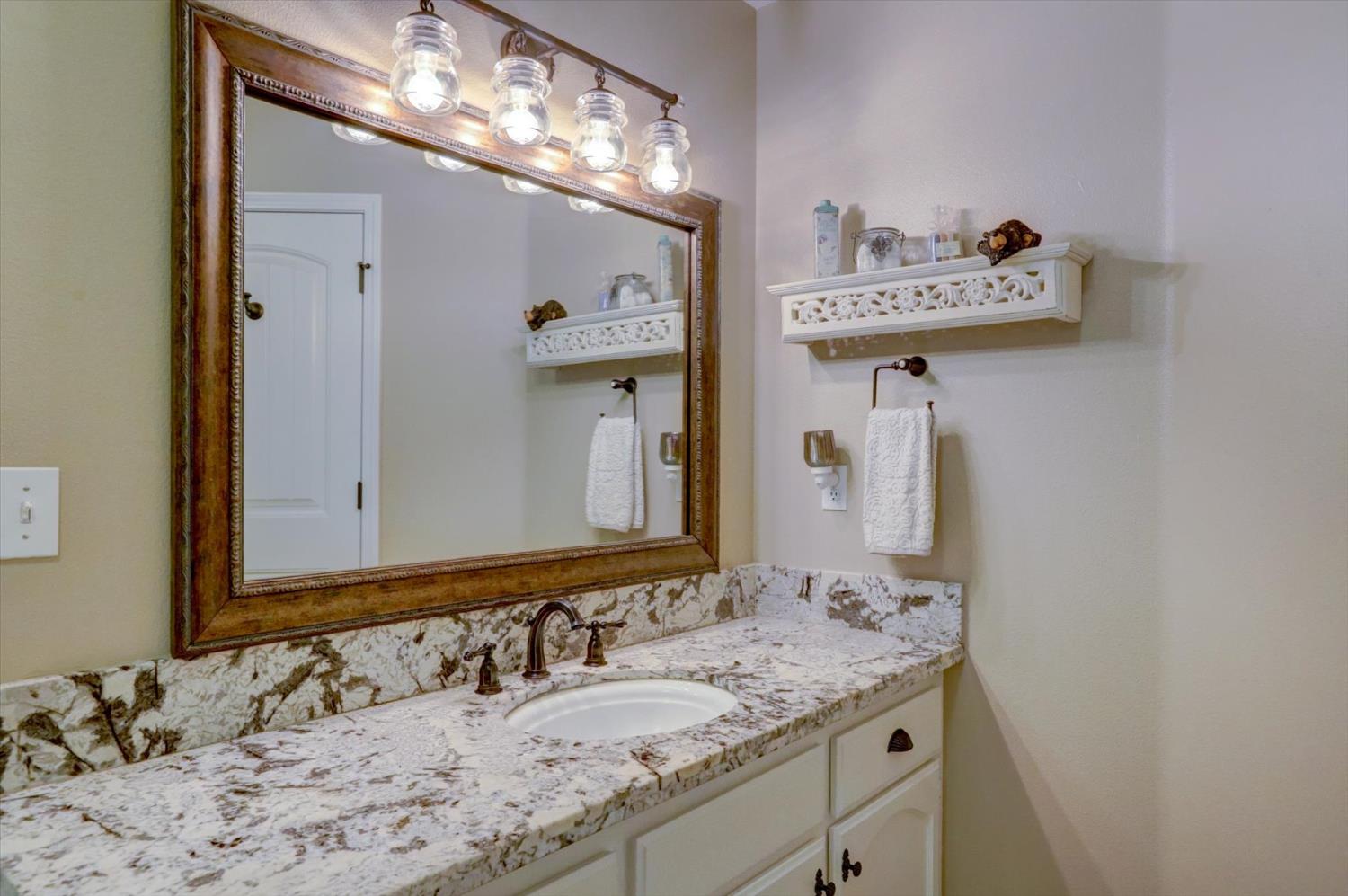 19793 Scotts Flat Road Nevada City, CA 95959 - Photo 21 of 50 a bathroom with a sink and a mirror