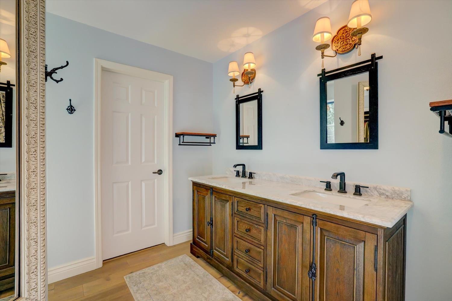 19793 Scotts Flat Road Nevada City, CA 95959 - Photo 25 of 50 a bathroom with 2 sink and a mirror