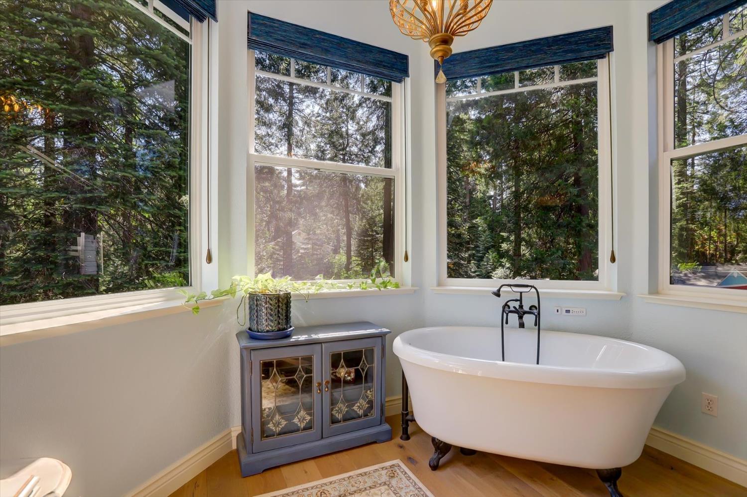 19793 Scotts Flat Road Nevada City, CA 95959 - Photo 26 of 50 a white bath tub sitting in a bathroom next to a window