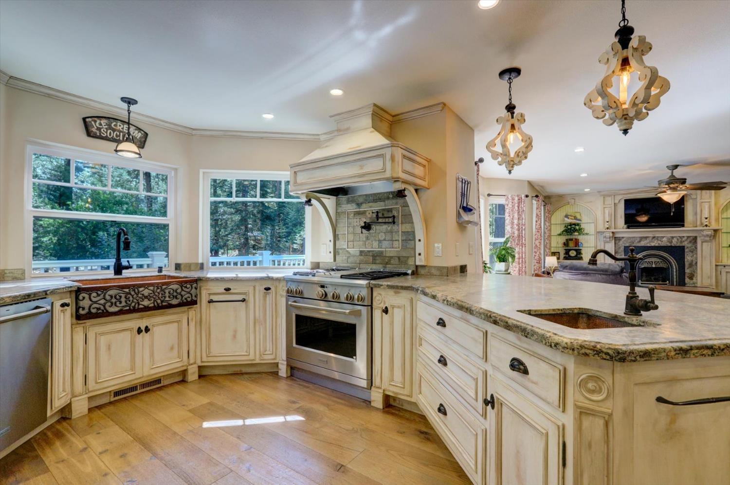 19793 Scotts Flat Road Nevada City, CA 95959 - Photo 3 of 50 a kitchen with stainless steel appliances granite countertop a sink stove and refrigerator