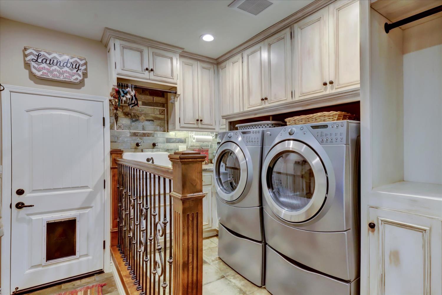 19793 Scotts Flat Road Nevada City, CA 95959 - Photo 33 of 50 a utility room with fridge dryer and washer