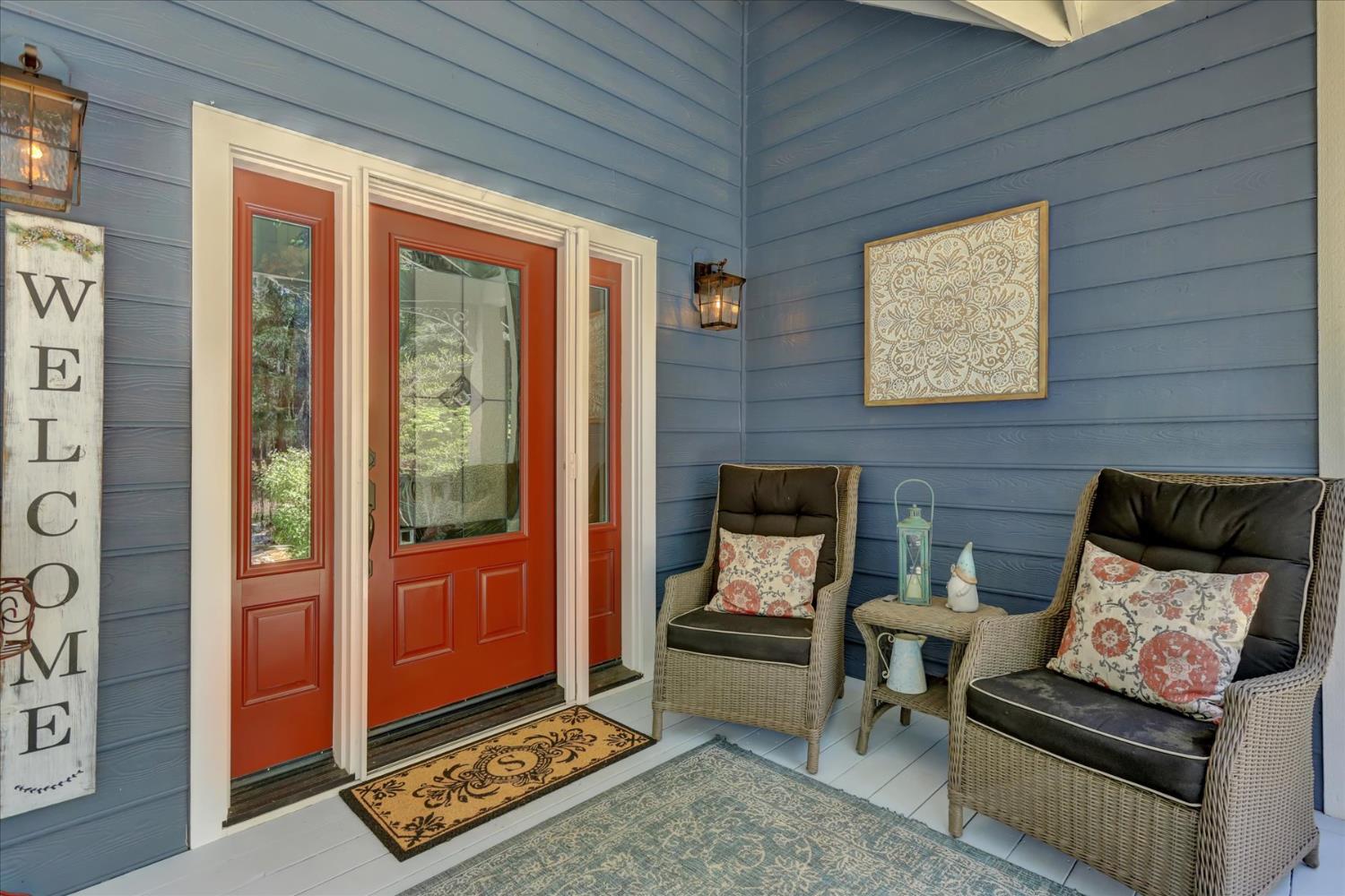 19793 Scotts Flat Road Nevada City, CA 95959 - Photo 35 of 50 a living room with furniture a rug and a window