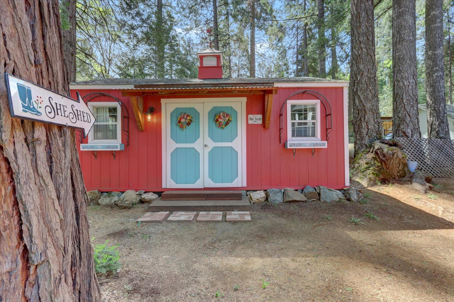 19793 Scotts Flat Road Nevada City, CA 95959 - Photo 43 of 50 a front view of a house with a yard and garage