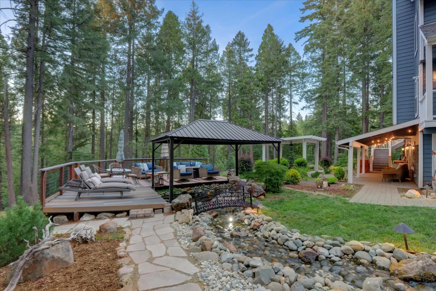 19793 Scotts Flat Road Nevada City, CA 95959 - Photo 6 of 50 a view of a patio with furniture and a yard