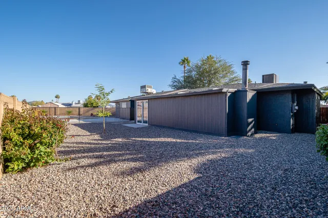 a view of a yard with potted plants
