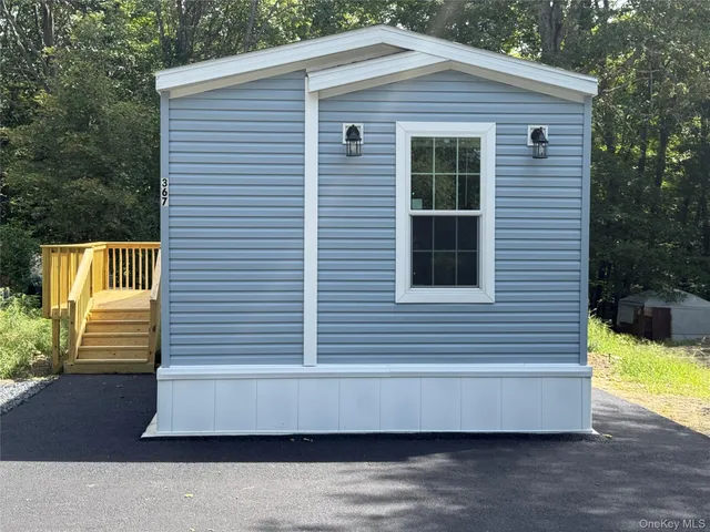 a kitchen with stainless steel appliances granite countertop a refrigerator stove a sink dishwasher and microwave