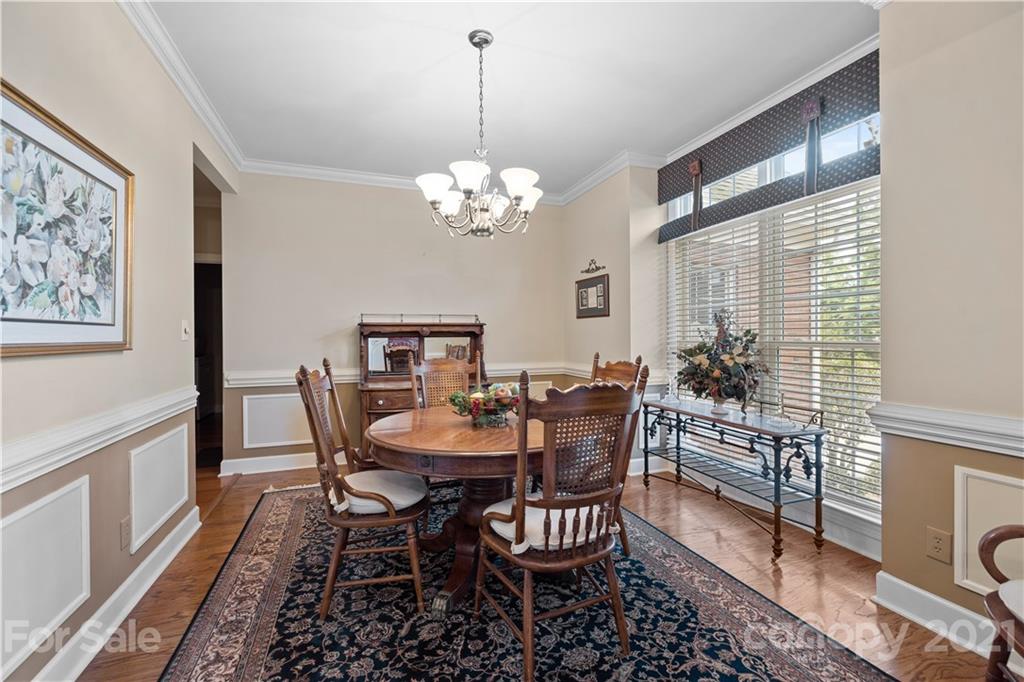 348 Gringley Hill Road Fort Mill, SC 29708 - Photo 12 of 33 a view of a dining room with furniture window and wooden floor