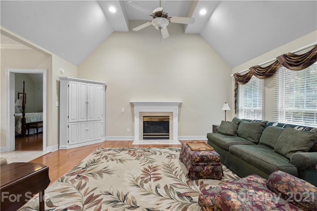 348 Gringley Hill Road Fort Mill, SC 29708 - Photo 14 of 33 a bedroom with furniture and a fireplace