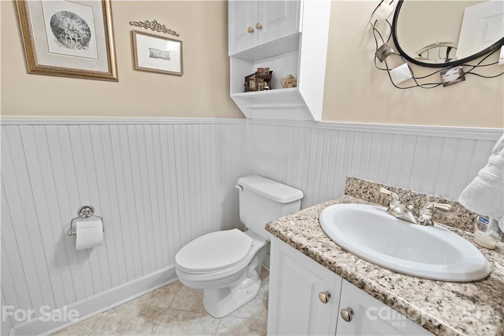 348 Gringley Hill Road Fort Mill, SC 29708 - Photo 23 of 33 a bathroom with a granite countertop sink and a mirror