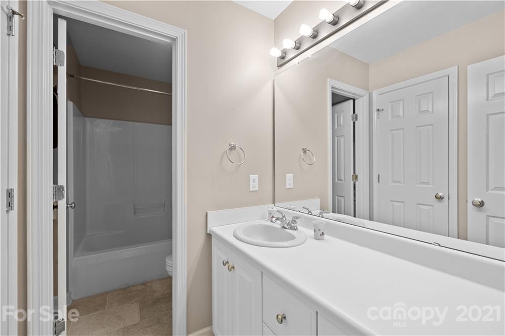 348 Gringley Hill Road Fort Mill, SC 29708 - Photo 30 of 33 a bathroom with a sink and a mirror