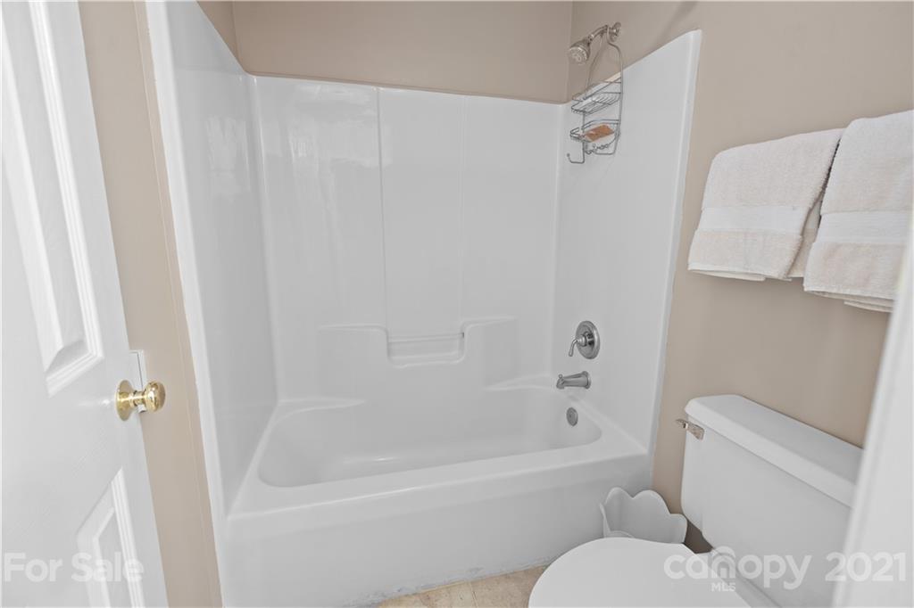 348 Gringley Hill Road Fort Mill, SC 29708 - Photo 31 of 33 a white bath tub sitting next to a white toilet and sink