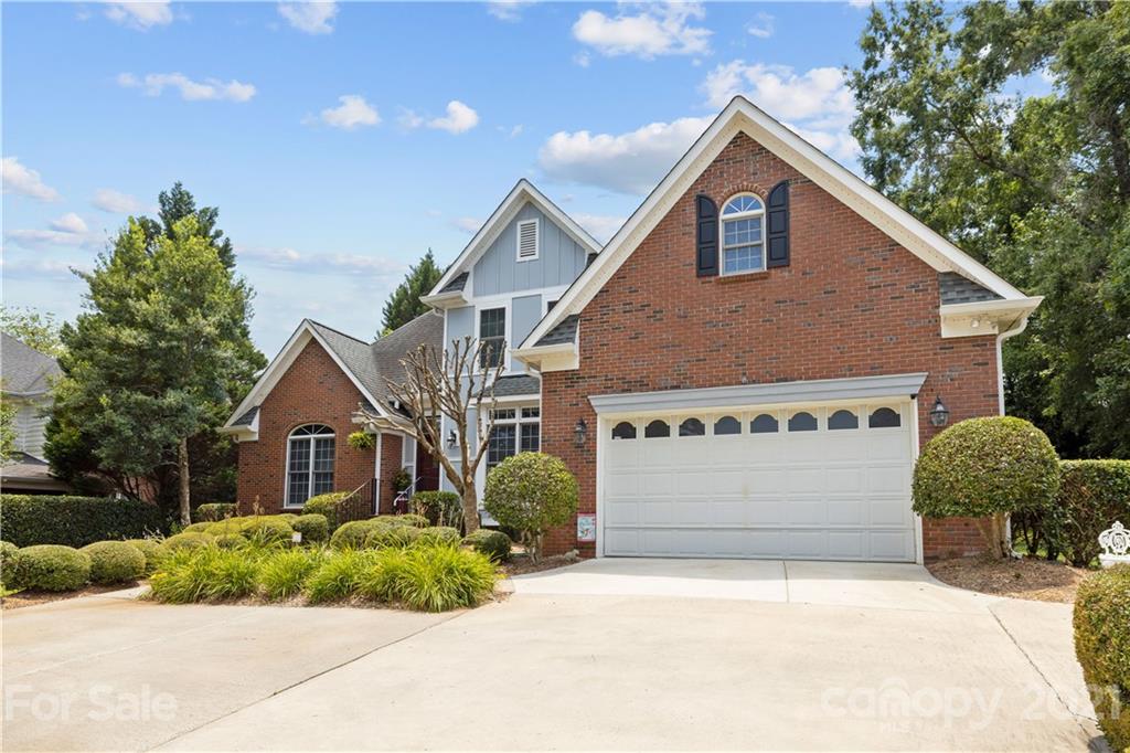 348 Gringley Hill Road Fort Mill, SC 29708 - Photo 32 of 33 a front view of a house with a yard and garage