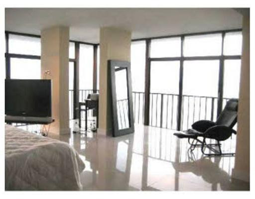 1925 Brickell Avenue, Unit DPH5 Miami, FL 33129 - Photo 4 of 4 a living room with furniture and a flat screen tv