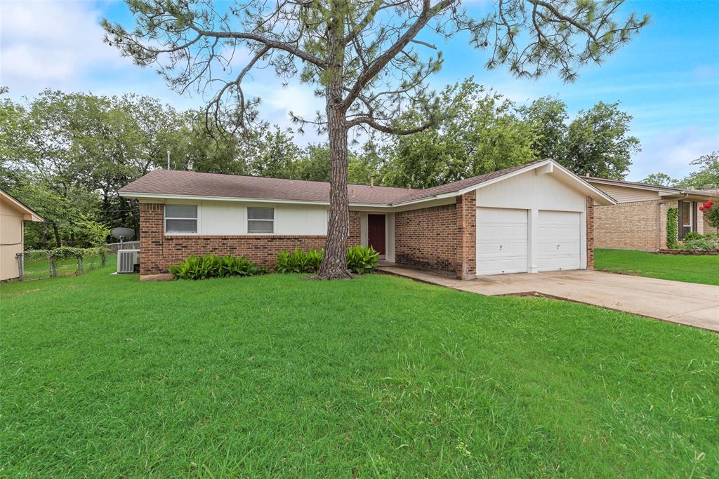 508 Neptune Drive Denton, TX 76209 - Photo 1 of 1 Ranch-style house with brick siding, a garage, and driveway