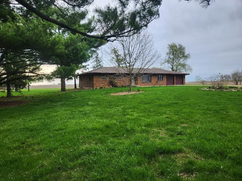 1281 Spring Center Road Belvidere, IL 61008 - Photo 1 of 19 a view of backyard of house with green space