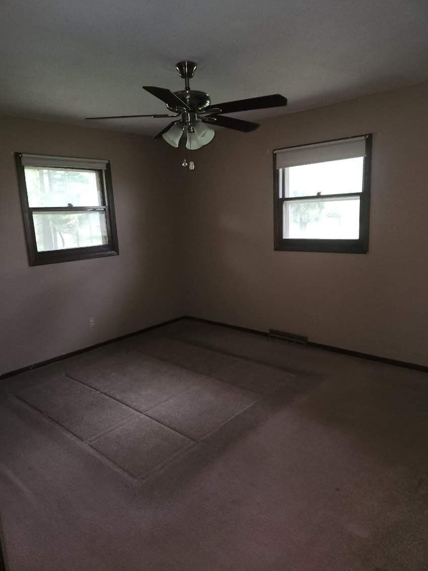 1281 Spring Center Road Belvidere, IL 61008 - Photo 17 of 19 a view of an empty room with a window
