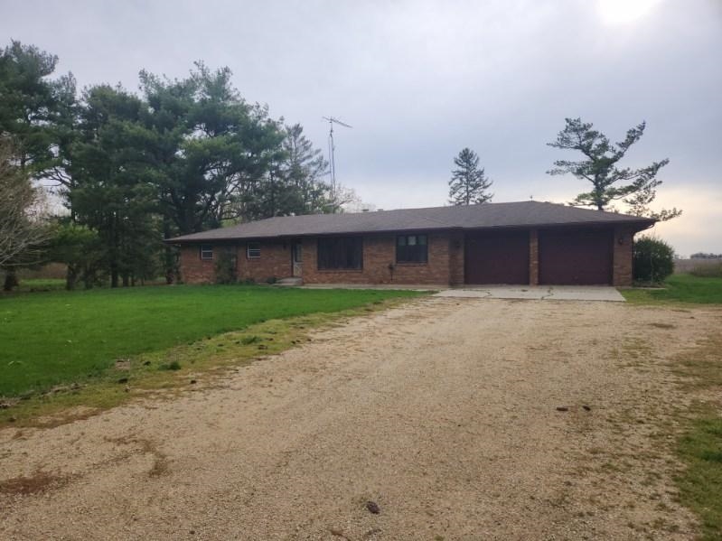 1281 Spring Center Road Belvidere, IL 61008 - Photo 2 of 19 a view of a house with a yard and a garden