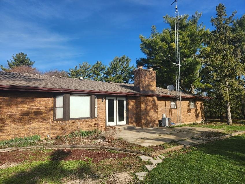 1281 Spring Center Road Belvidere, IL 61008 - Photo 5 of 19 a front view of a house with a yard