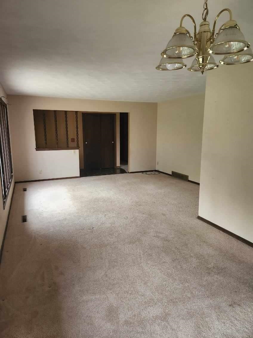 1281 Spring Center Road Belvidere, IL 61008 - Photo 8 of 19 a view of a big room with a fireplace