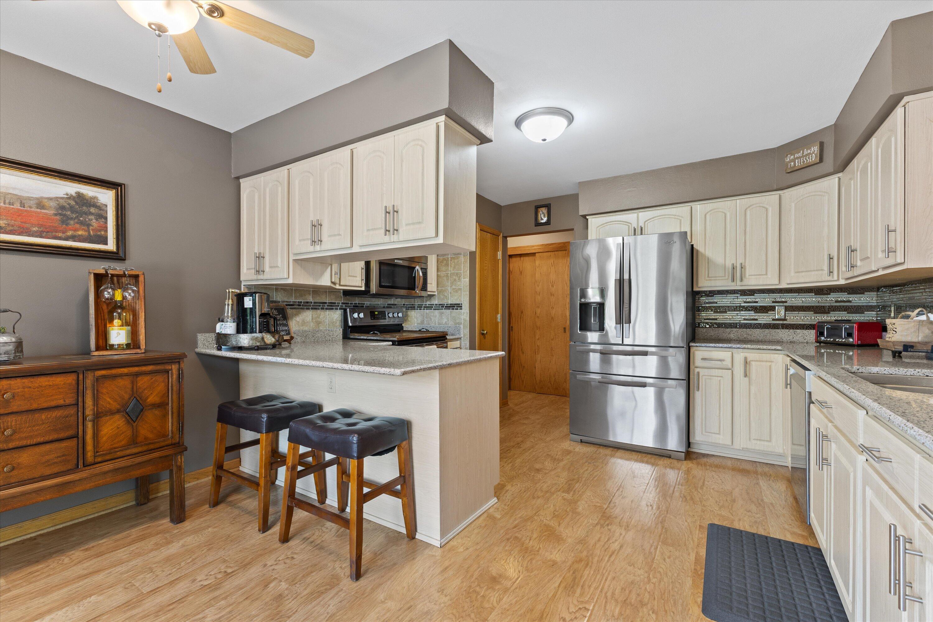 6620 Ranger Drive Mount Pleasant, WI 53406 - Photo 22 of 41 Breakfast bar area, granite countertops