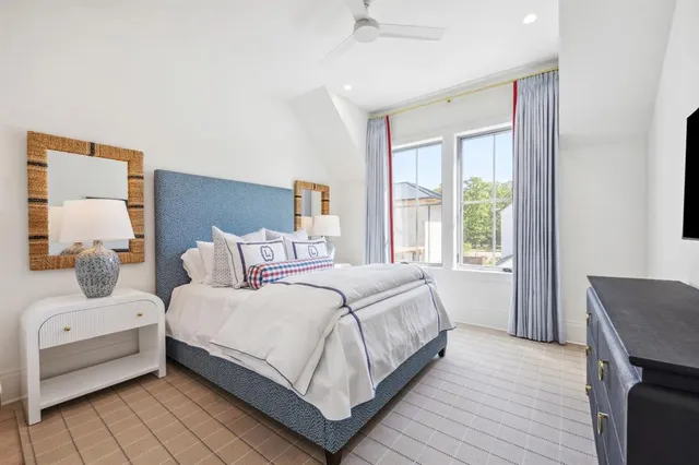 a bedroom with a bed and a couch