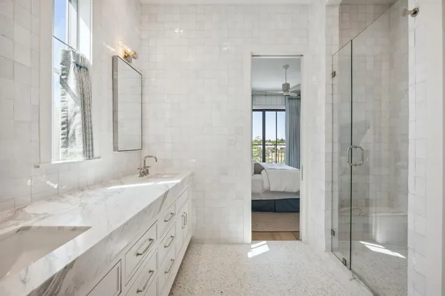 a view of a hallway with windows and entryway