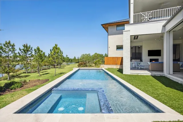 a view of swimming pool with a patio