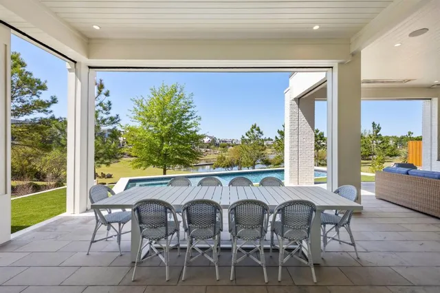 a outdoor dining space with furniture and window
