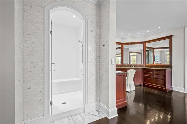 a bedroom with a bed wooden floor and window