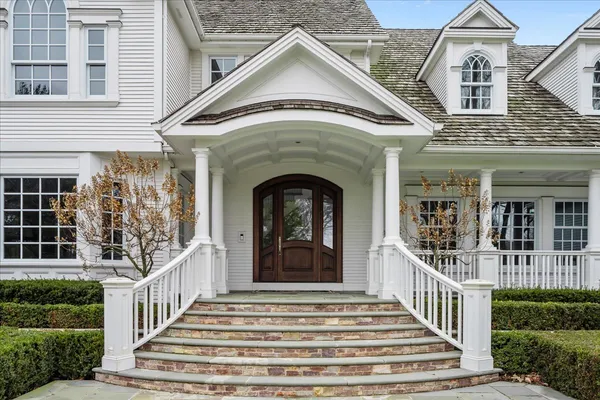 a view of a house with entrance and windows