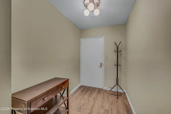 a view of an empty room with a window