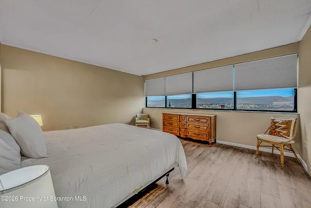 a bedroom with a bed and a cabinets