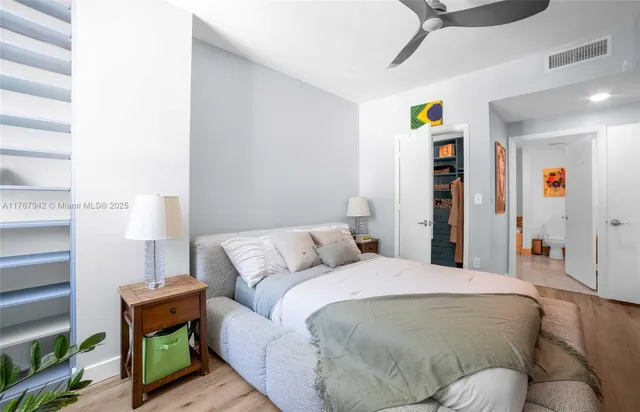 a bedroom with a bed and a couch