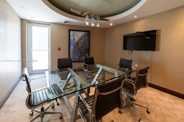 a room with lots of furniture and wooden floor