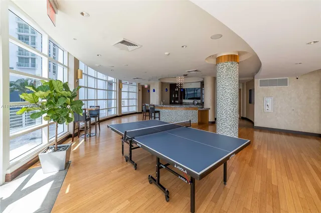 a media room with lots of chairs and a projector