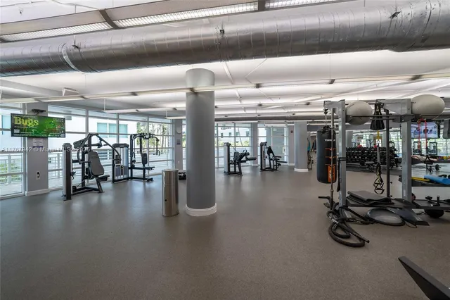 a room with furniture and a large window