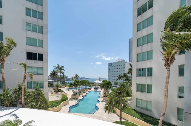a bathroom with a sink mirror and shower