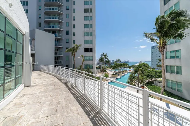 a large bathroom with a large mirror vanity and sink