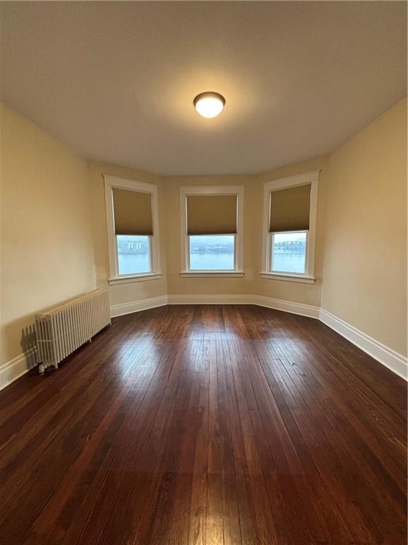 501 Atlantic Avenue Monaca, PA 15061 - Photo 19 of 29 an empty room with wooden floor and windows